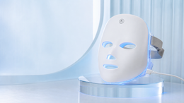 MLUESKIN LED face mask illuminated in blue in a cool studio setting